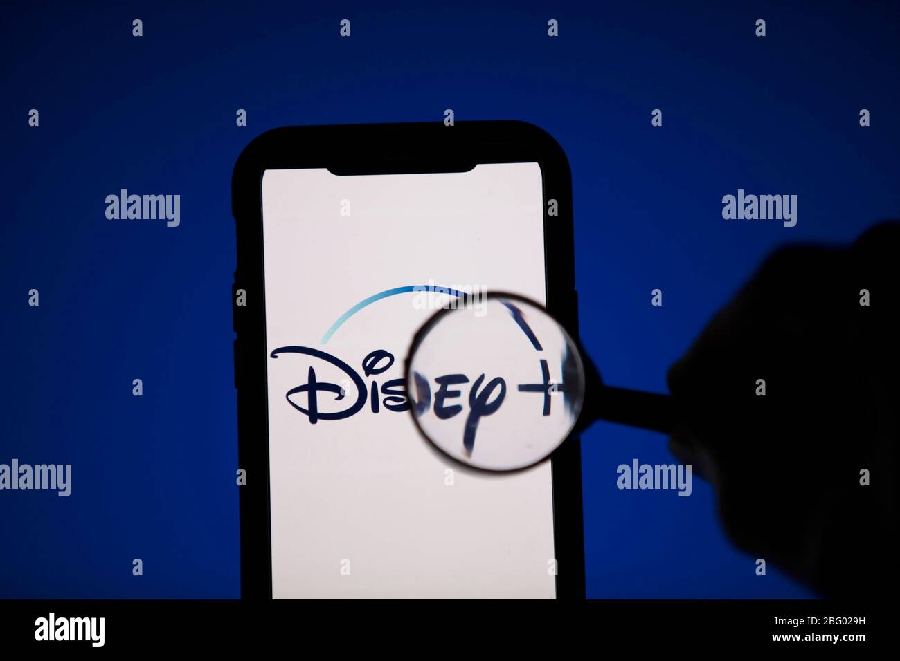 LONDON, UK - April 17 2020: Disney streaming service logo under a microscope Stock Photo