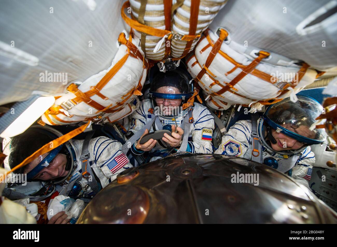 ZHEZKAZGAN, KAZAKHSTAN - 17 April 2020 - Expedition 62 crew members Andrew Morgan of NASA, left, Roscosmos cosmonaut Oleg Skripochka, center, and NASA Stock Photo