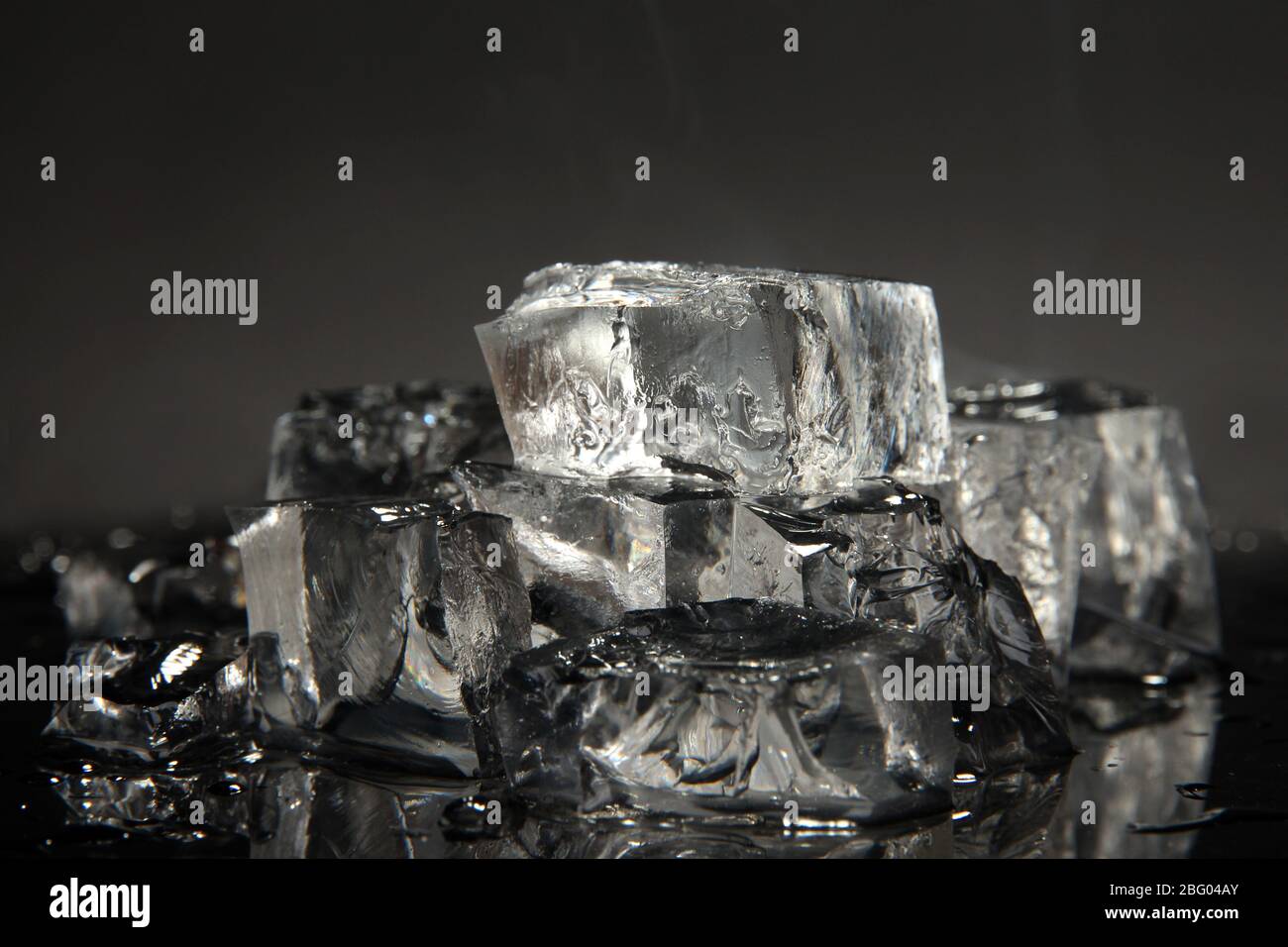 Ice cubes isolated on black Stock Photo - Alamy