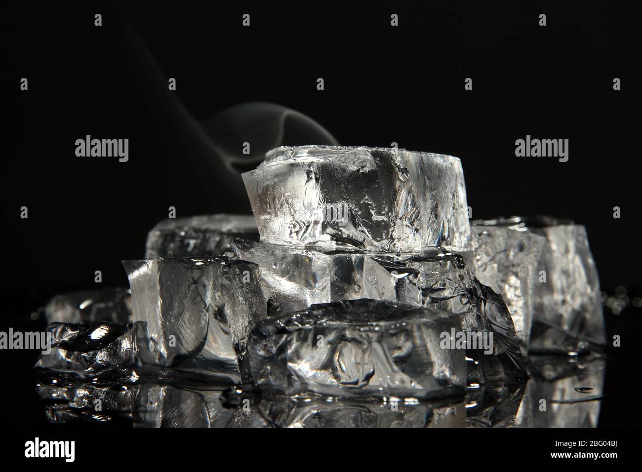 Ice cubes isolated on black Stock Photo - Alamy