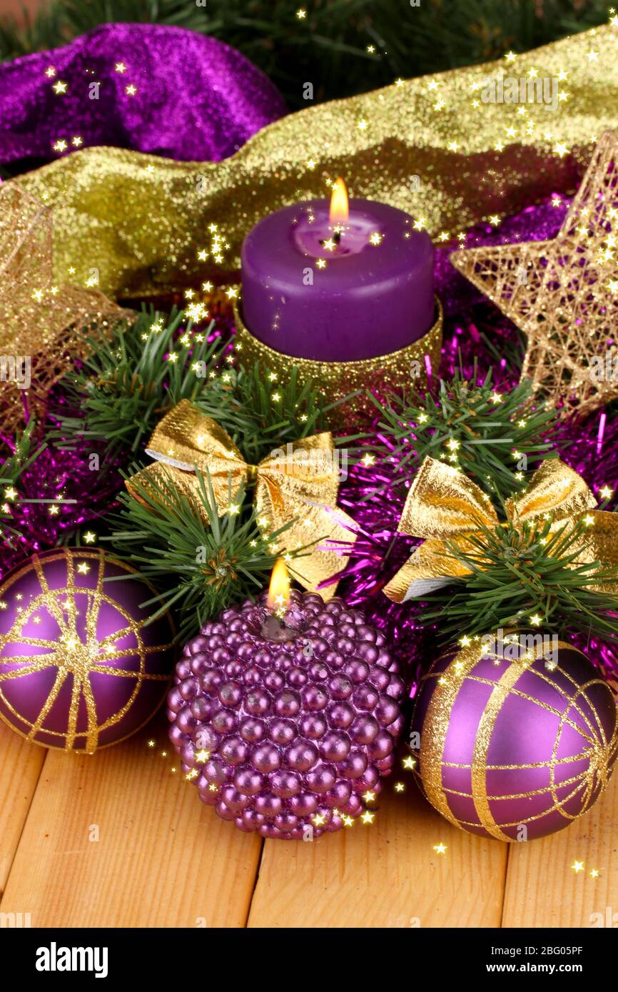 Christmas Composition With Candles And Decorations In Purple And Gold Colors On Wooden Background Stock Photo Alamy