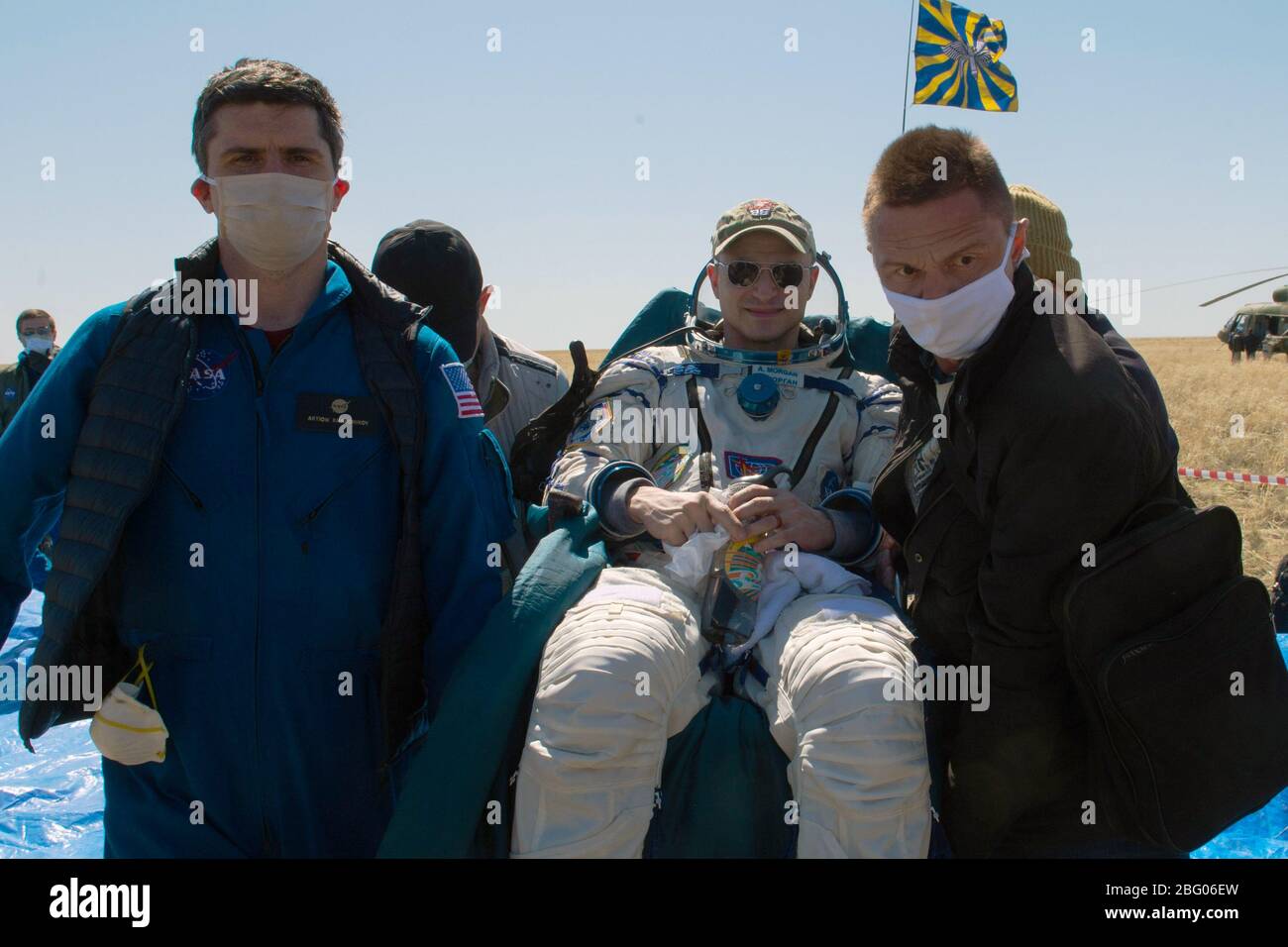ZHEZKAZGAN, KAZAKHSTAN - 17 April 2020 - Expedition 62 crew member Andrew Morgan of NASA is carried to an All Terrain Vehicle (ATV) shortly after he, Stock Photo