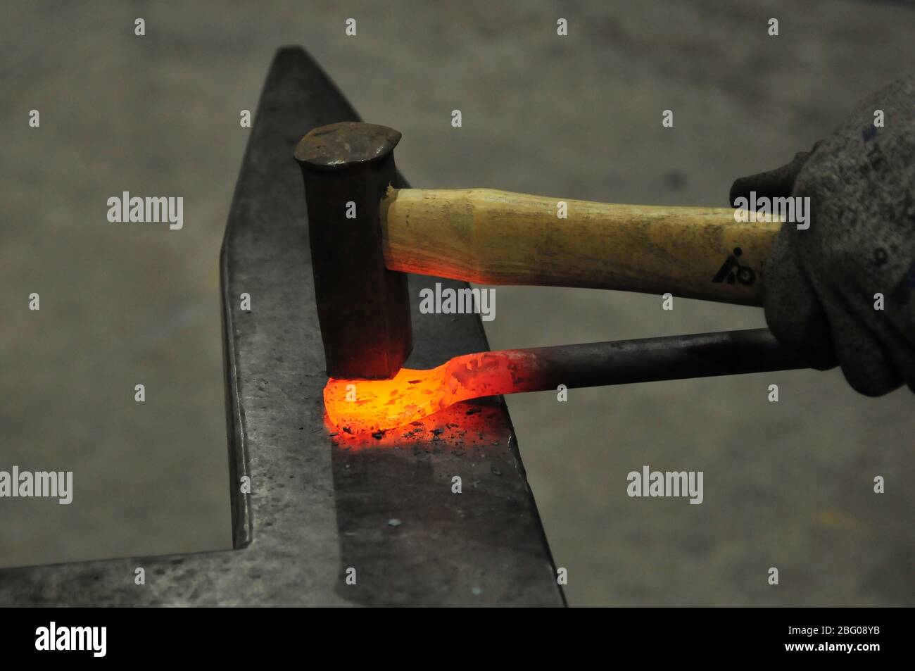 Iron forging on an anvil Stock Photo