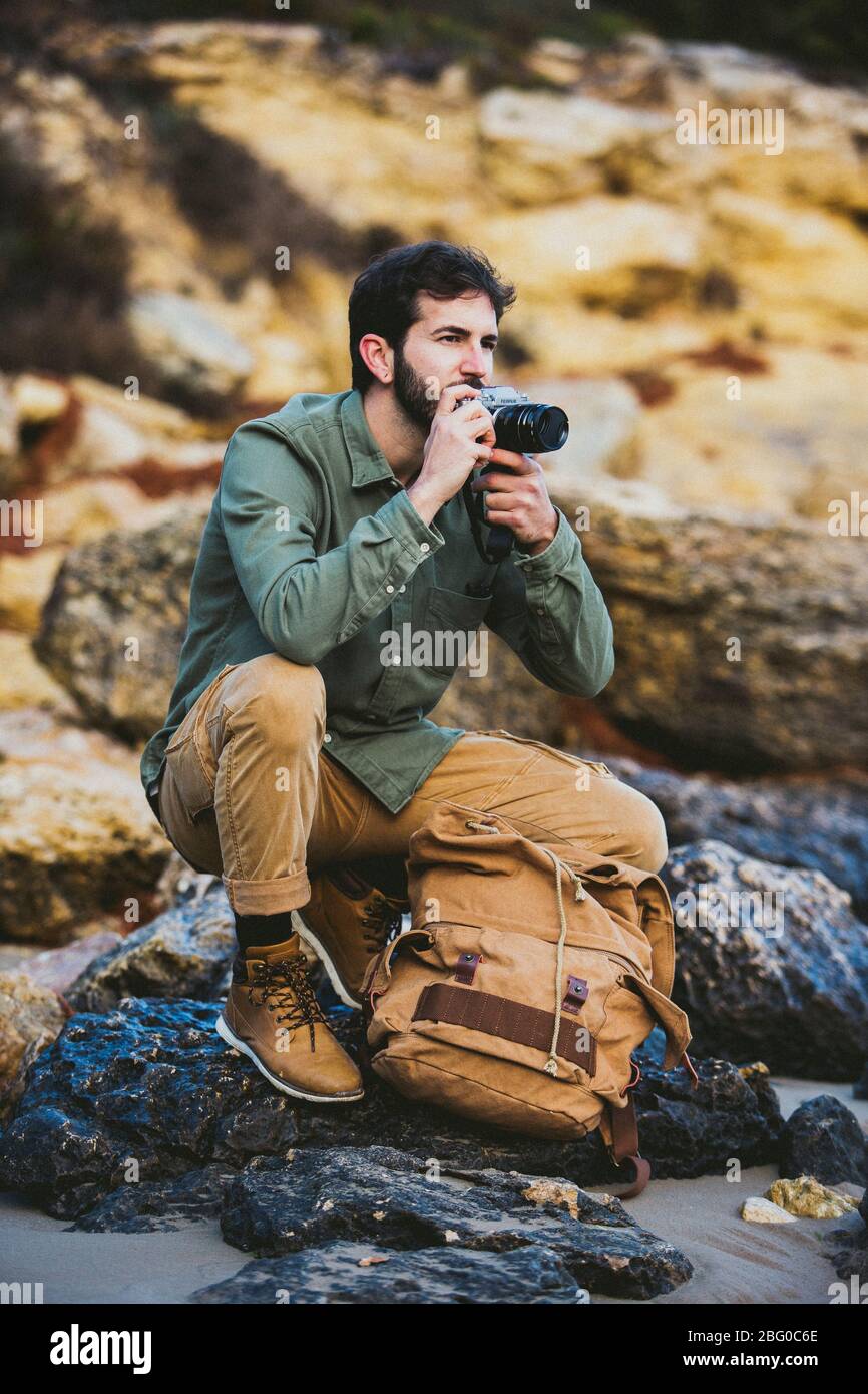 Portrait of young Man taking pictures outdoors Stock Photo