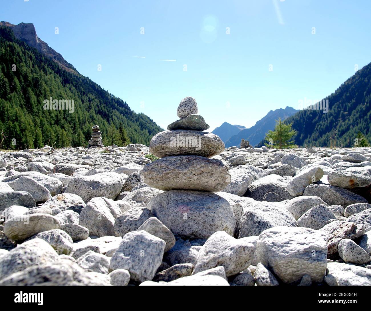 stone pyramids, little man, mound, ovoo, Inukshuk built for your calm and tranquility in the blue sky Stock Photo