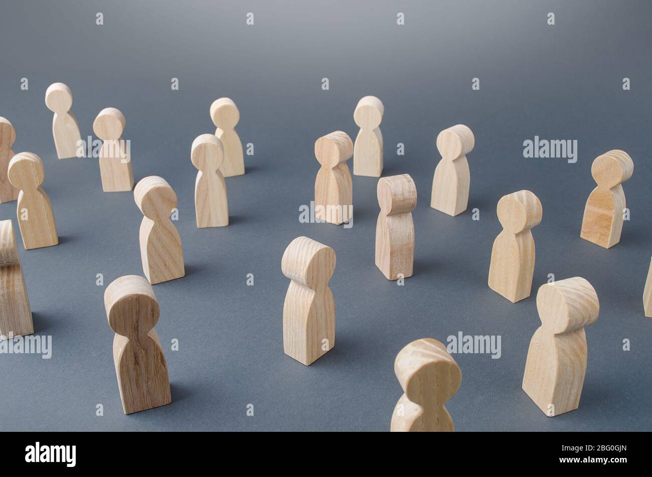 Many figures of people stand at a distance. People Society Concept. Behavior and social science relationships. Manipulation and management. Marketing, Stock Photo