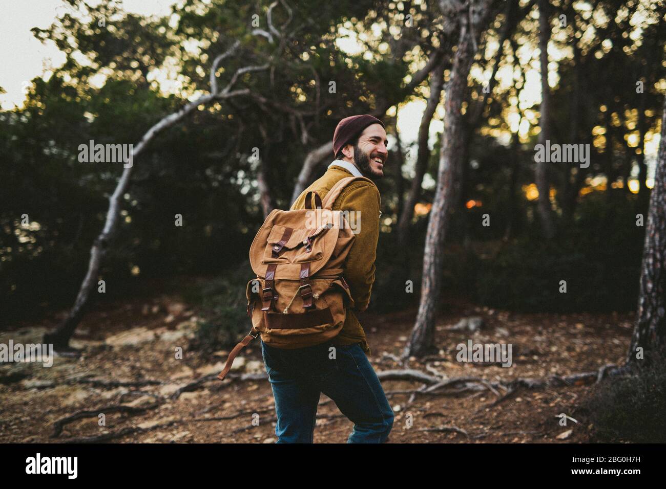 Portrait Of Young Man Carrying Camera outdoors Stock Photo