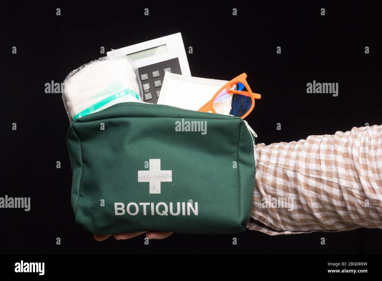 For the first cures, a first aid kit is necessary in which basic sanitary material, such as betadine, alcohol, bandages, scissors, pain relievers, sti Stock Photo