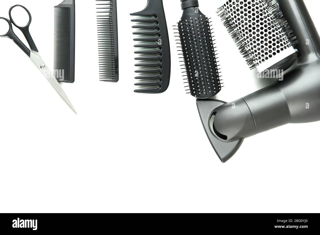 Comb brushes, hairdryer and cutting shears, isolated on white Stock Photo Alamy