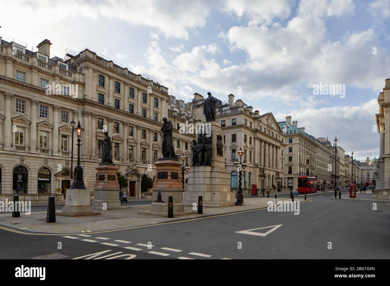 Empty deserted streets of Waterloo Place and Regent St during restricted travel of Coronavirus COVID-19 Lockdown in London SW1, England Stock Photo