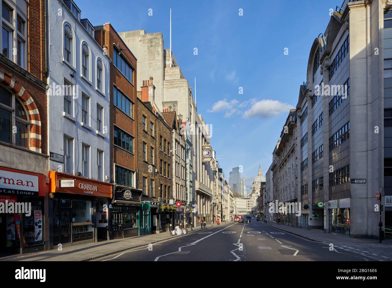 Empty deserted walkway and shops of Fleet St during restricted travel of Coronavirus COVID-19 Lockdown in London WC2, England Stock Photo