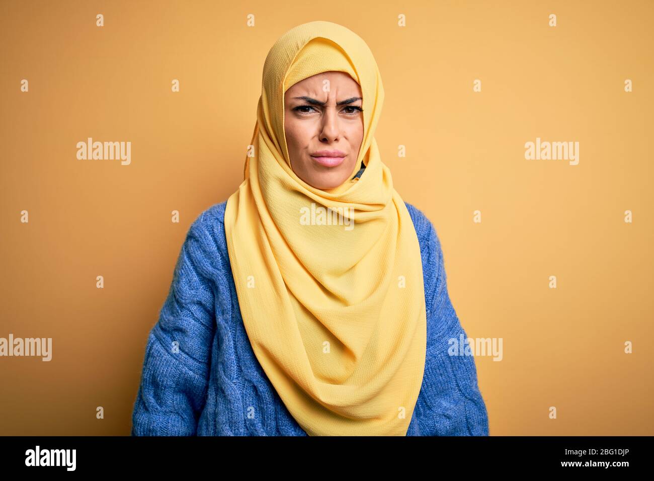 Young Beautiful Brunette Muslim Woman Wearing Arab Hijab Over Isolated Yellow Background Skeptic And Nervous Frowning Upset Because Of Problem Negat Stock Photo Alamy