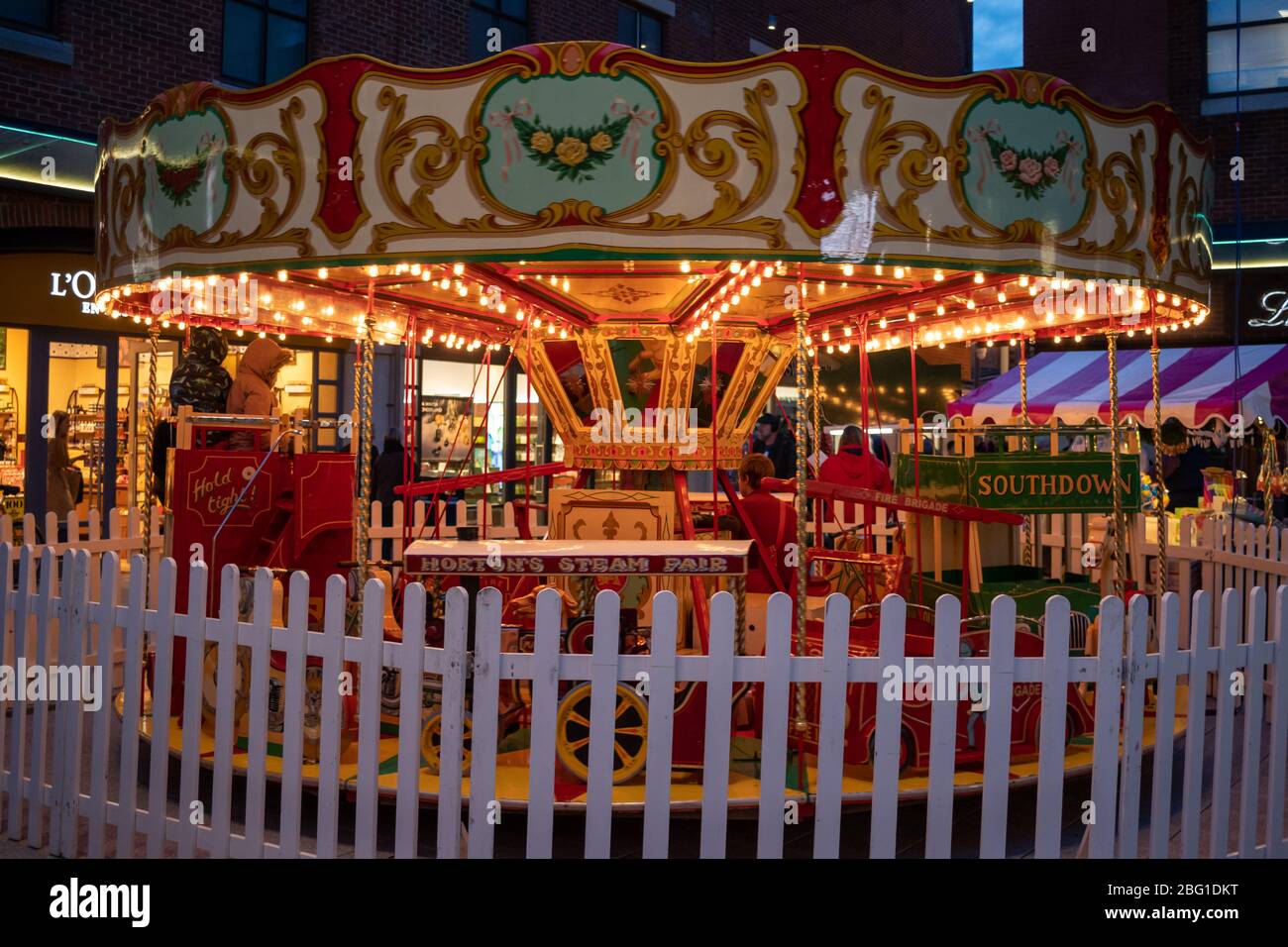 A traditional old carousel at a fare at night Stock Photo