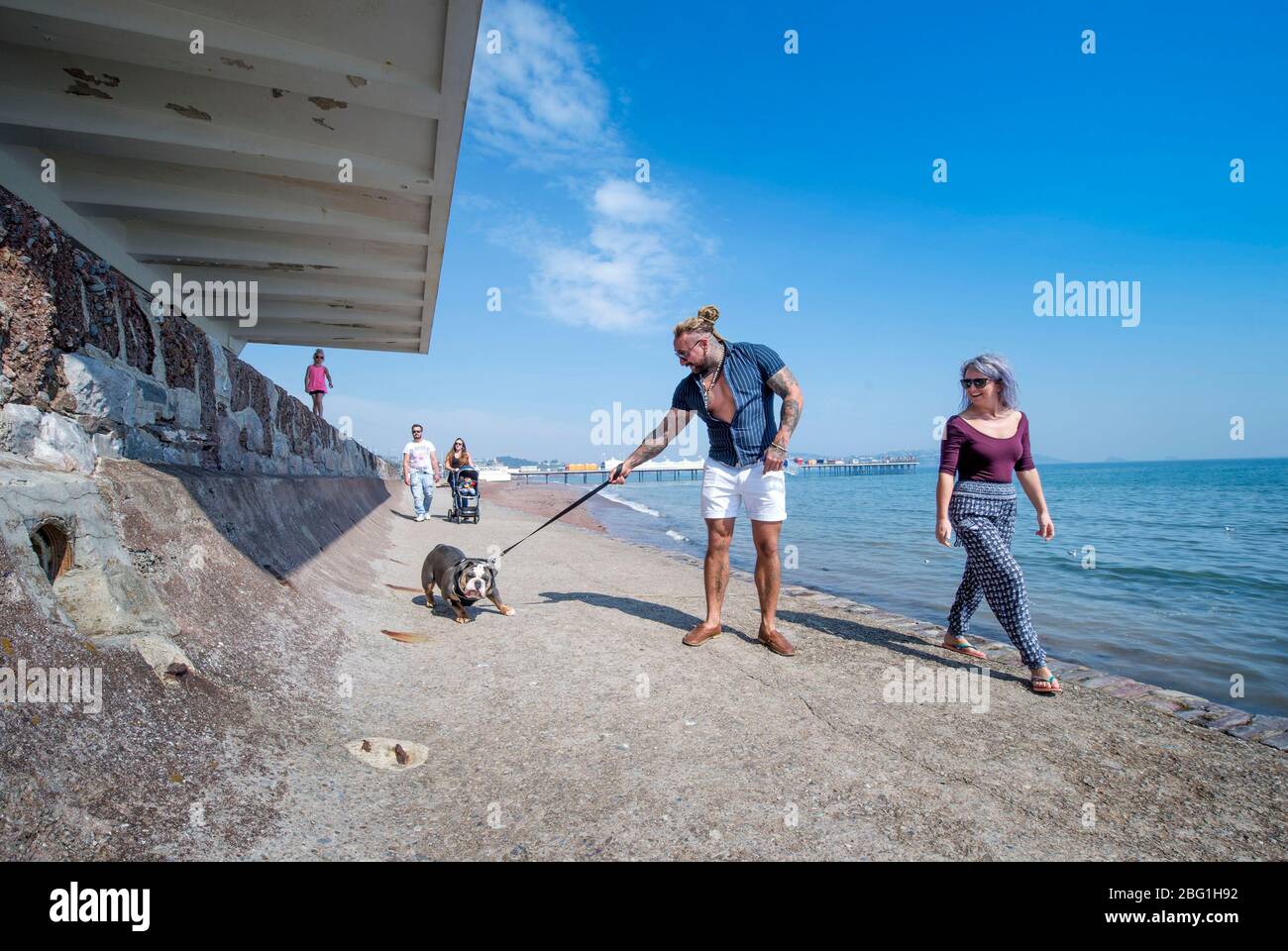 Dog walkers on Paignton seafront during the Coronavirus lockdown, UK Stock Photo