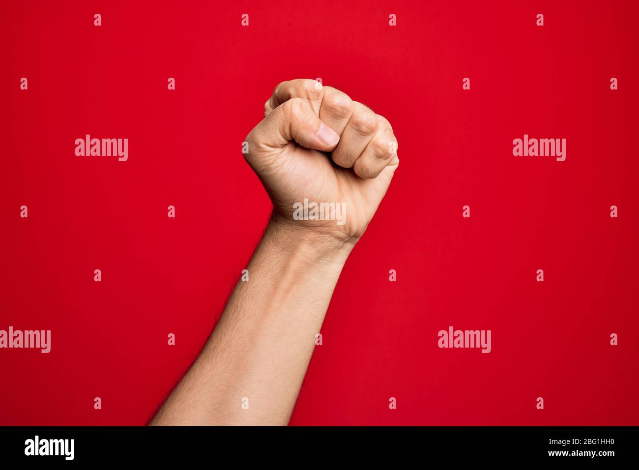 Hand Using Force Hand of caucasian young man showing fingers over isolated red ...
