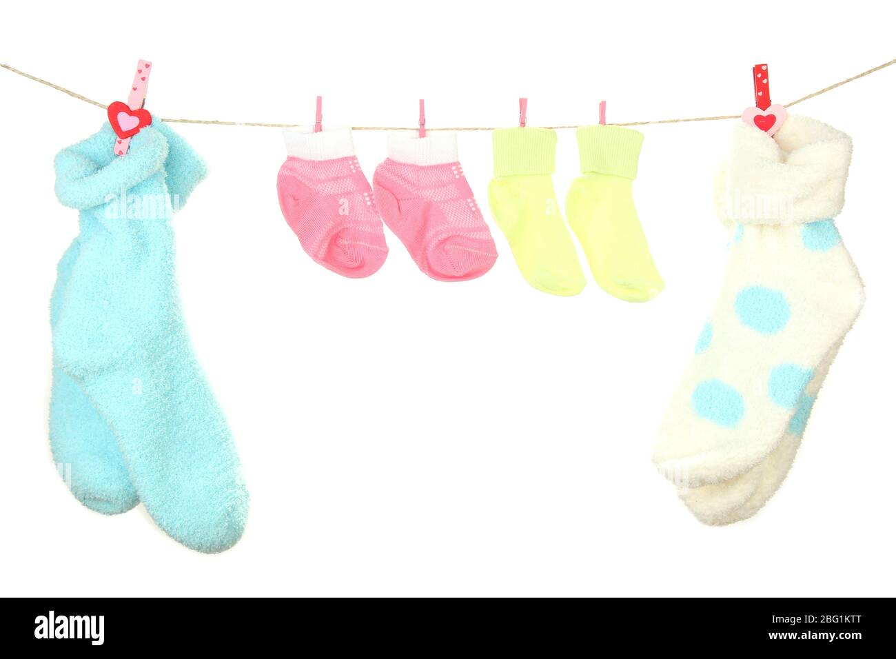 Colorful socks hanging on clothesline, isolated on white Stock Photo