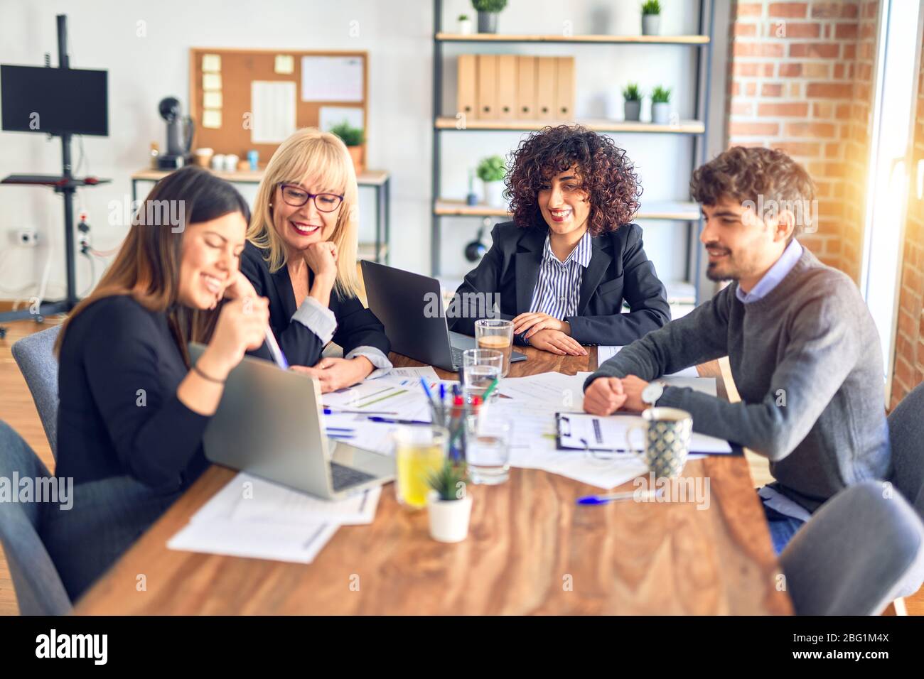 Working Smiling Group of business workers smiling happy and confident. Working together ...