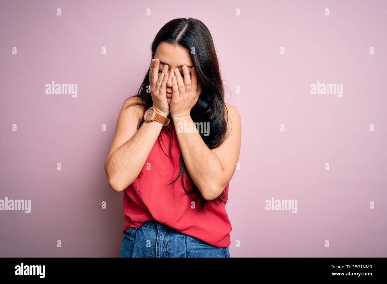 Young brunette woman wearing casual summer shirt over pink isolated background rubbing eyes for fatigue and headache, sleepy and tired expression. Vis Stock Photo