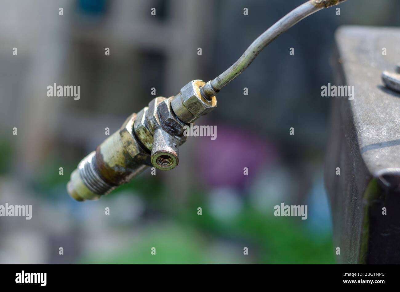 Diesel fuel injector with a drop of fuel. Single fuel injector on a