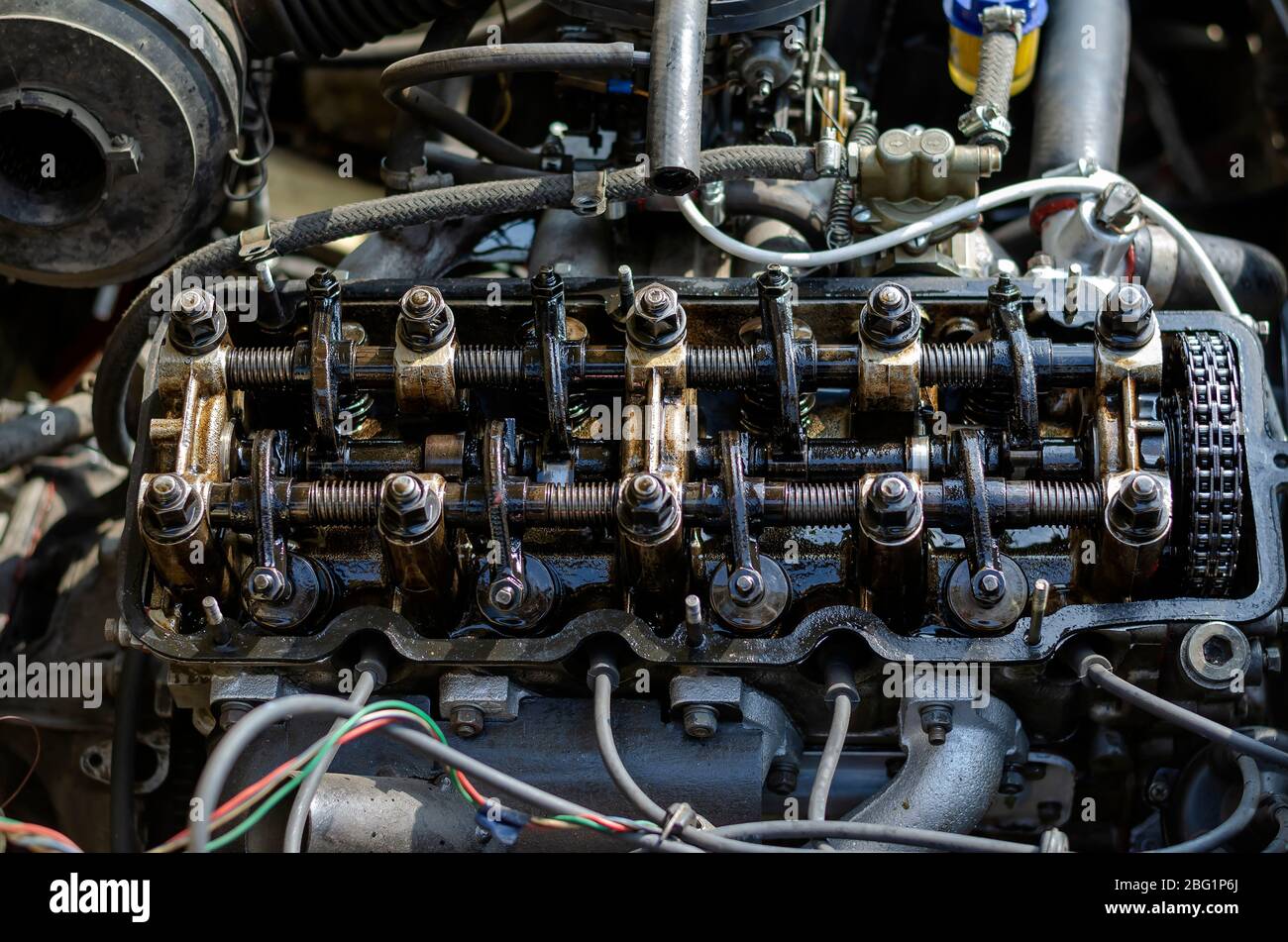 Disassembled fourstroke gasoline engine. Detailed shot of carburetor