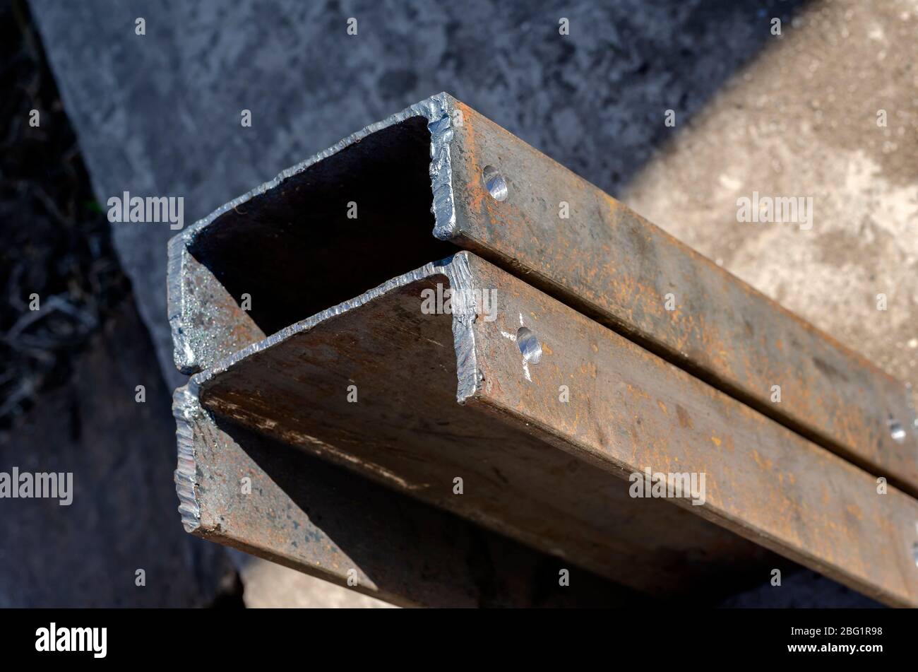 Metal construction details. Two metal channels with holes in the upper part. Industrial topics
