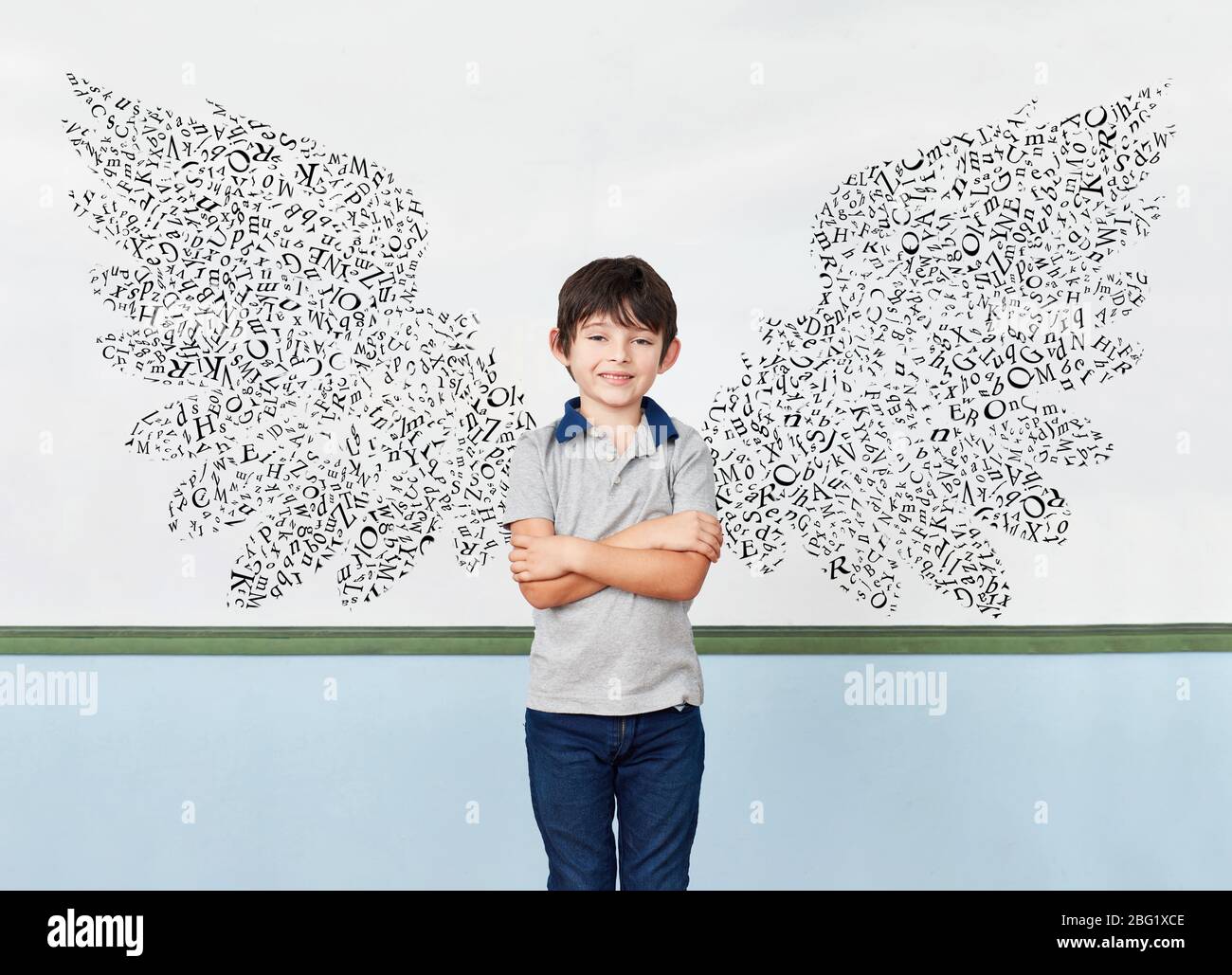 Pupils in front of blackboard with wings of letters as success and motivation concept Stock Photo