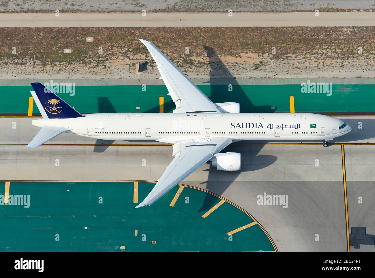 Saudia Airlines Boeing 777 taxiing at Los Angeles International Airport. Boeing 777-300 airplane HZ-AK40 aerial view. Saudi Arabian Airlines. Stock Photo