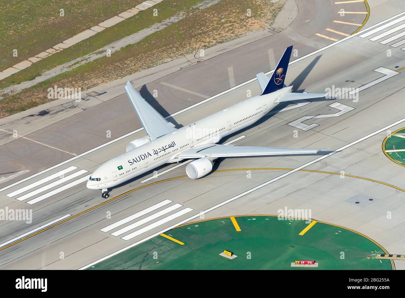 Saudi Arabian Airlines Boeing 777-300 departing Los Angeles International Airport. 777 airplane HZ-AK40 aerial view. Also know as Saudia Airlines. Stock Photo