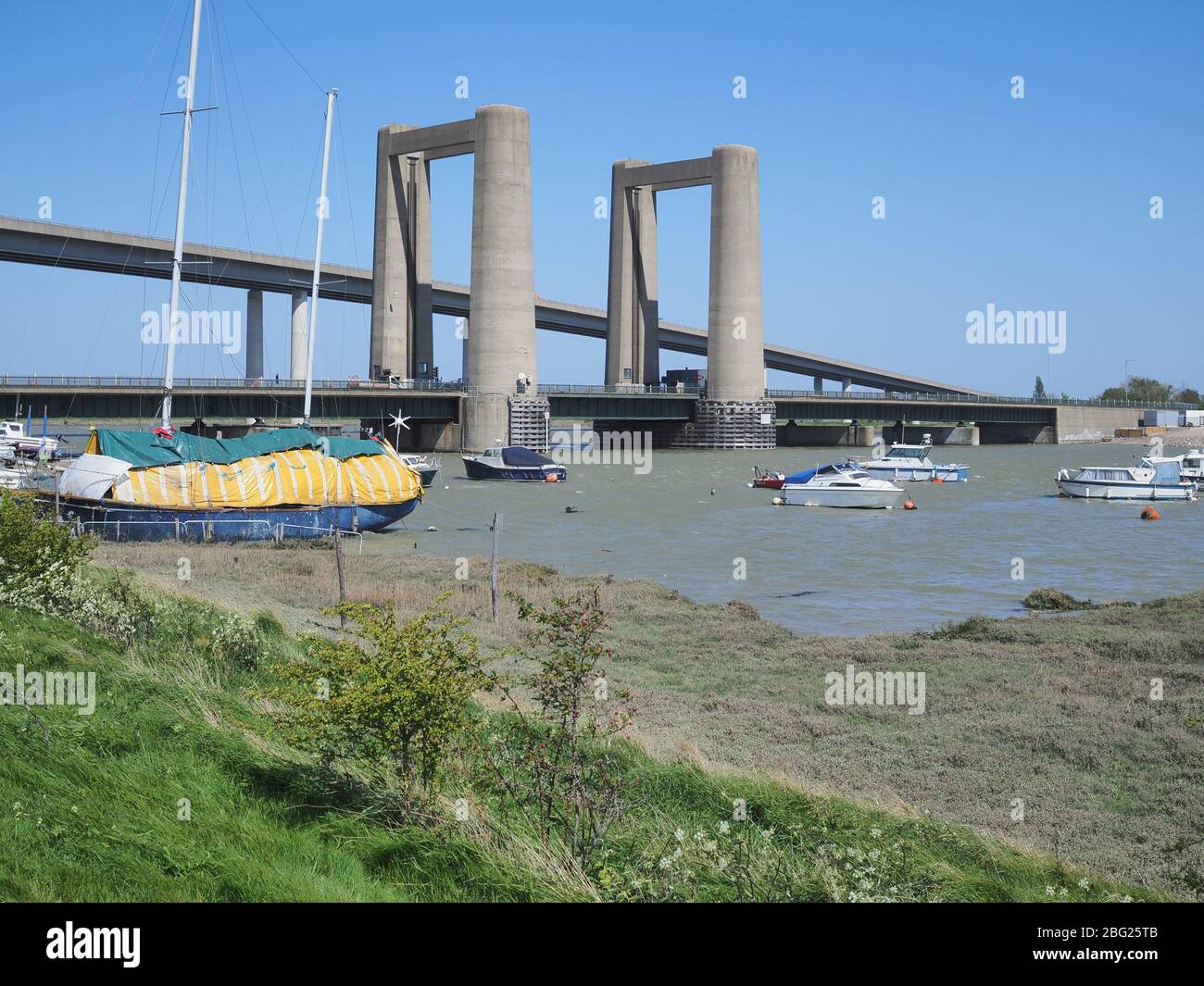 Iwade, Kent, UK. 20th Apr, 2020. Today is the 60th anniversary of the distinctive Kingsferry Bridge, linking Isle of Sheppey with mainland Kent, being opened by the Duchess of Kent on 20 Apr, 1960. At the time it was the largest lifting bridge built in Britain since the Second World War. There is only one other similar design in the world based in Holland. In 2006, the infamous Sheppey Crossing was opened, but Kingsferry was retained for rail and road traffic. A generator is in situ for lifting the centre span as the power system needs a replacement part. Credit: James Bell/Alamy Live News Stock Photo