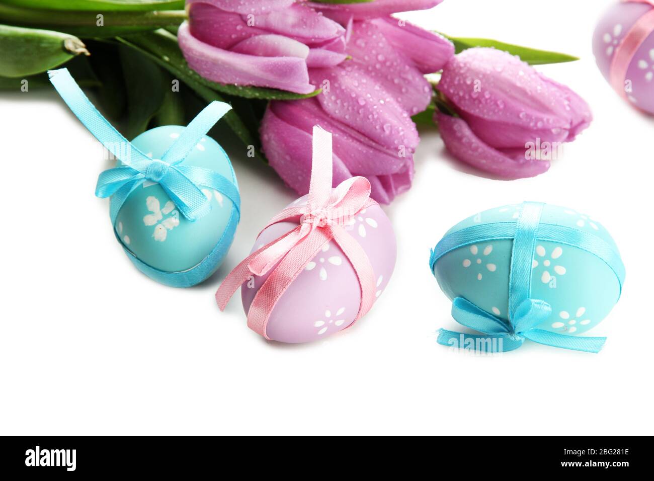 Bright easter eggs and tulips, isolated on white Stock Photo - Alamy