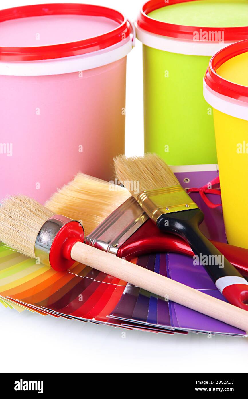 Set for painting paint pots, brushes, palette of colors close up Stock