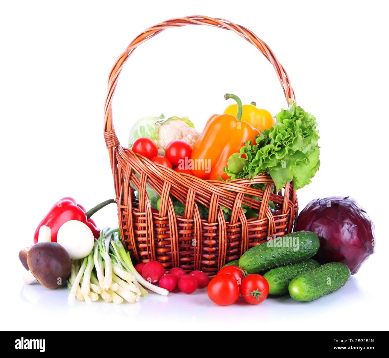 Fresh vegetables in wicker basket isolated on white Stock Photo - Alamy