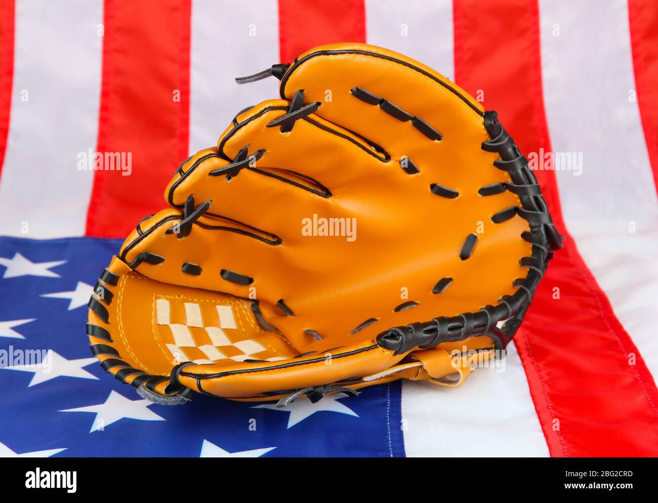 Baseball glove on American flag background Stock Photo - Alamy