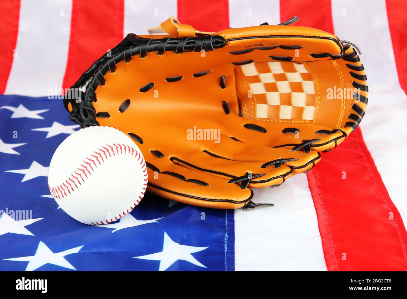 Baseball glove and ball on American flag background Stock Photo - Alamy