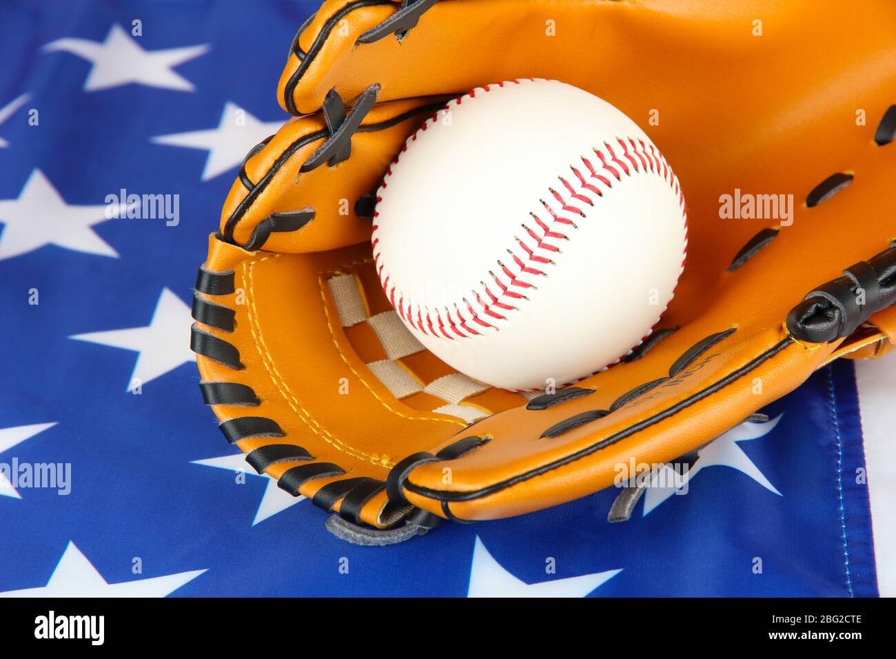 Baseball glove and ball on American flag background Stock Photo - Alamy