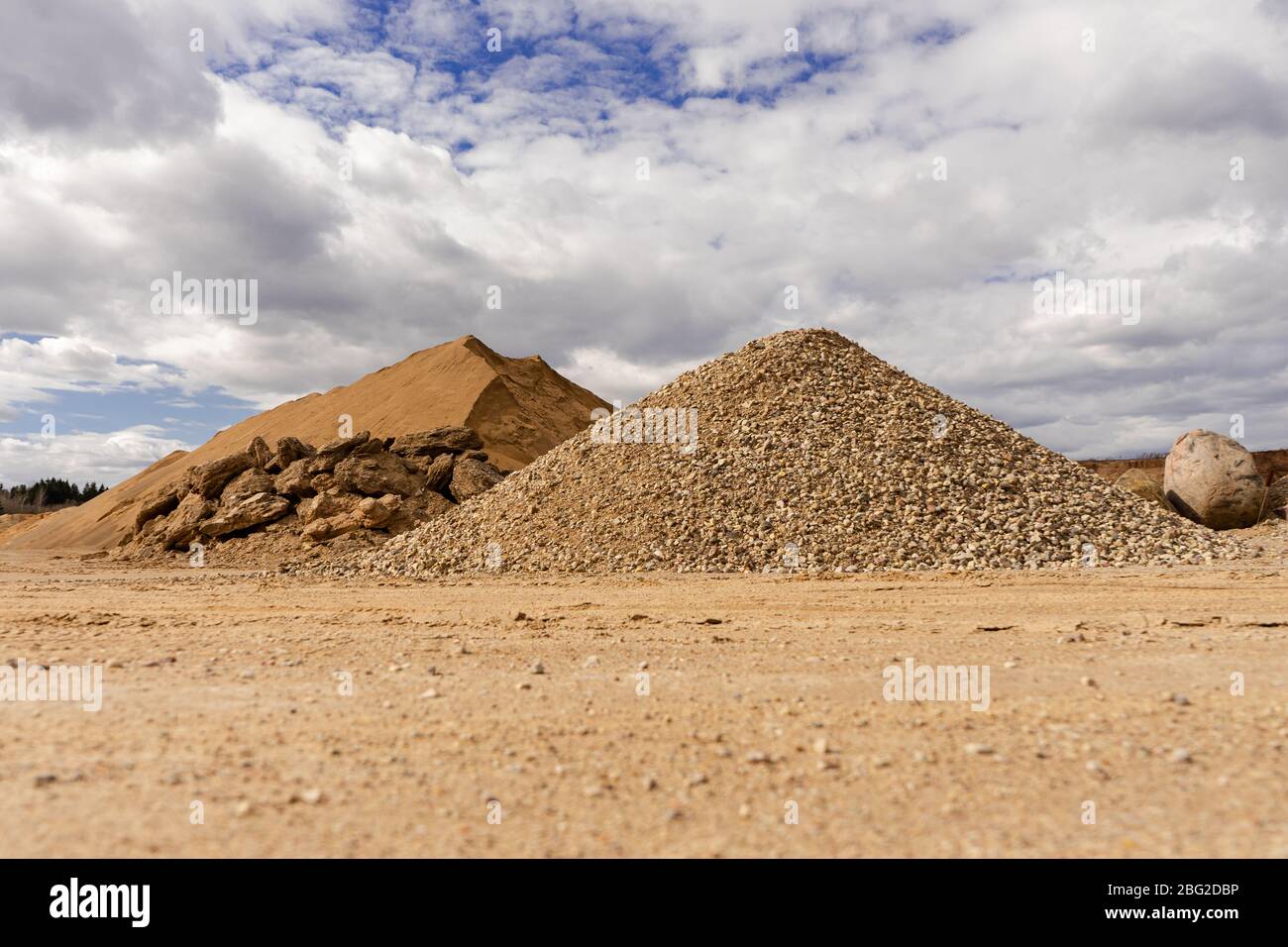 Open pit gravel mining. Large piles of construction sand and gravel ...