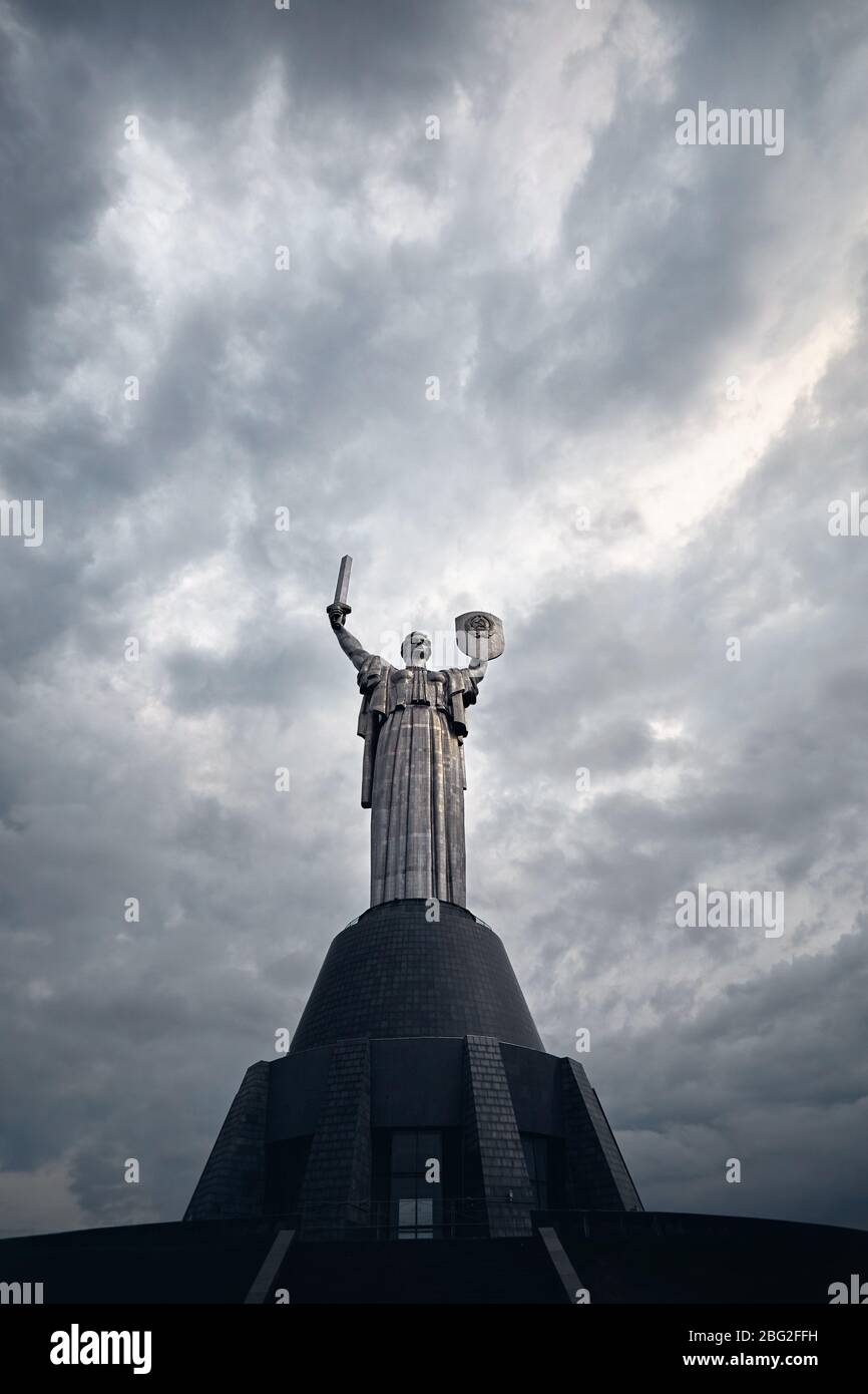 Mother Motherland statue at grey cloudy sky background in Kiev, Ukraine Stock Photo