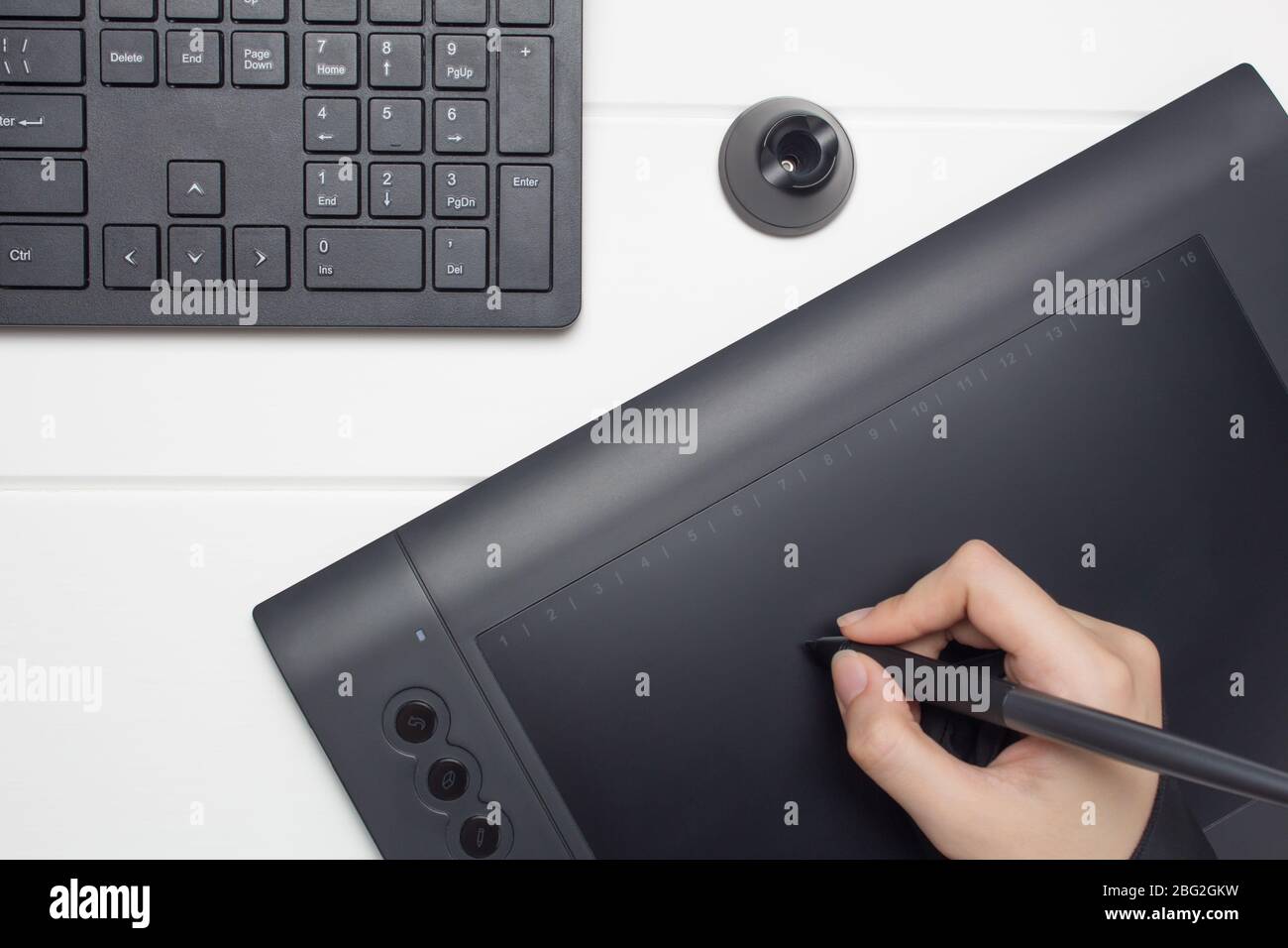 Graphic Designer Working On Digital Tablet The Hand Draws On A Graphics Tablet Freelance Designer Illustrator Technology Remote Work Outsourcin Stock Photo Alamy