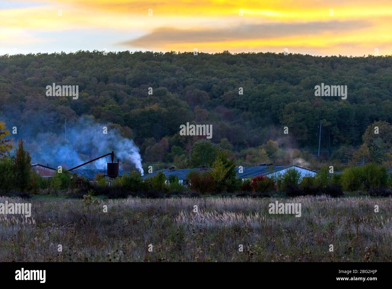 October Rural Background Rural background with countryside nature and houses in autumn evening ...