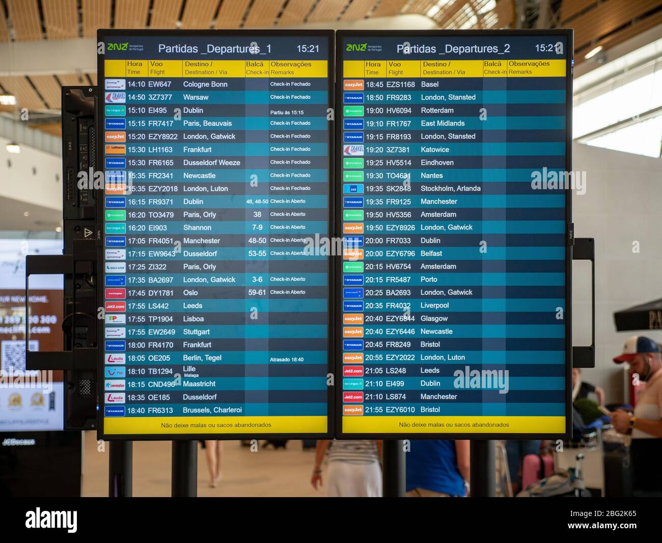 A flight departure board with information on times, gates, European locations and international airlines leaving from Faro Airport, Portugal. Stock Photo