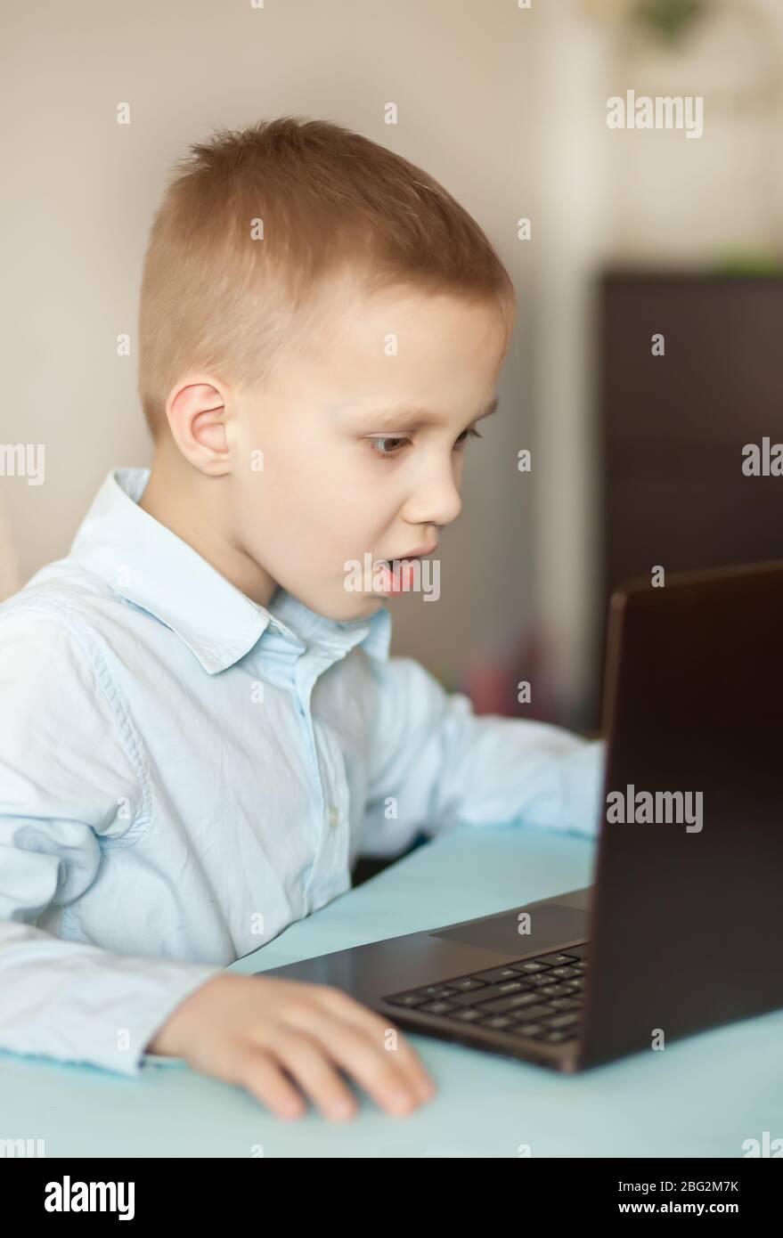 Workspace office desk with laptop. Kid learning online. Distance ...