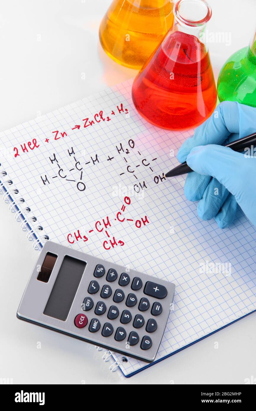 Hand scientist writing formulas isolated on white Stock Photo - Alamy