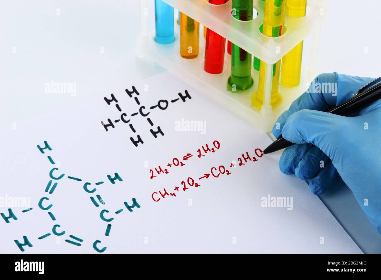 Hand scientist writing formulas isolated on white Stock Photo - Alamy