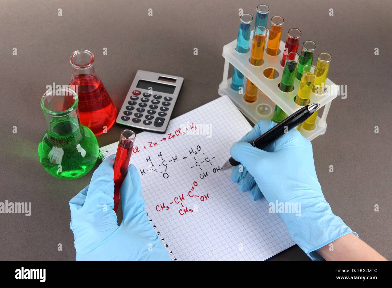 Hand scientist writing formulas Stock Photo - Alamy
