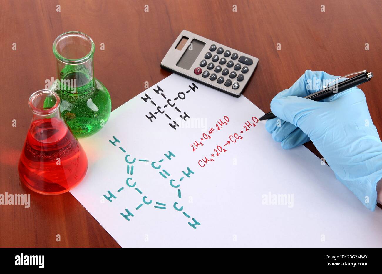 Hand scientist writing formulas Stock Photo - Alamy