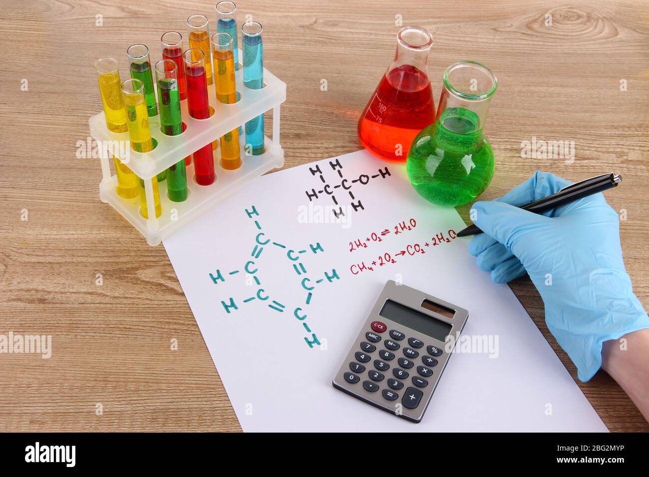 Hand scientist writing formulas Stock Photo - Alamy