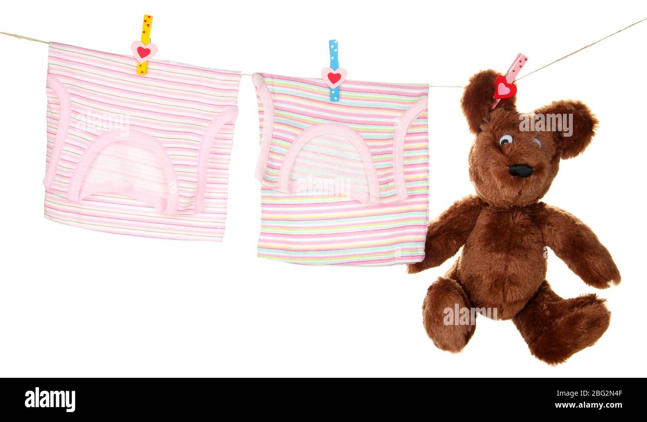 Baby clothes hanging on clothesline, isolated on white Stock Photo Alamy