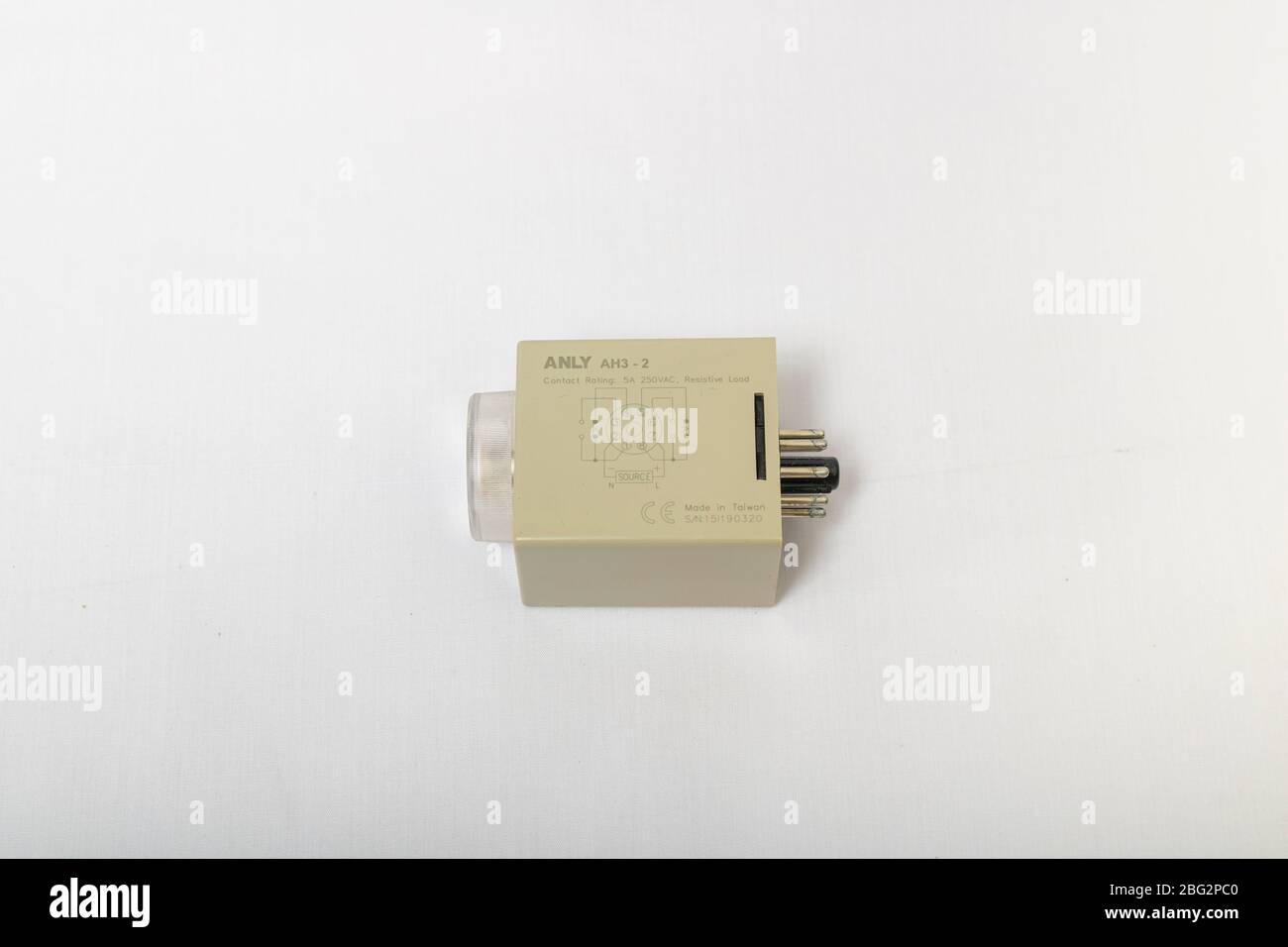 April 5,2020 - Bangkok, Thailand: An ANLY Multi range timer  on hand, which is timing relays and 8 pins socket terminal isolate on white background. Stock Photo