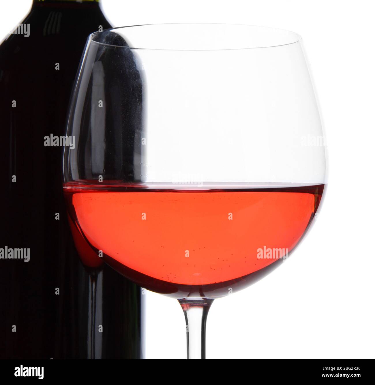 Red wine glass and bottle of wine isolated on white Stock Photo - Alamy