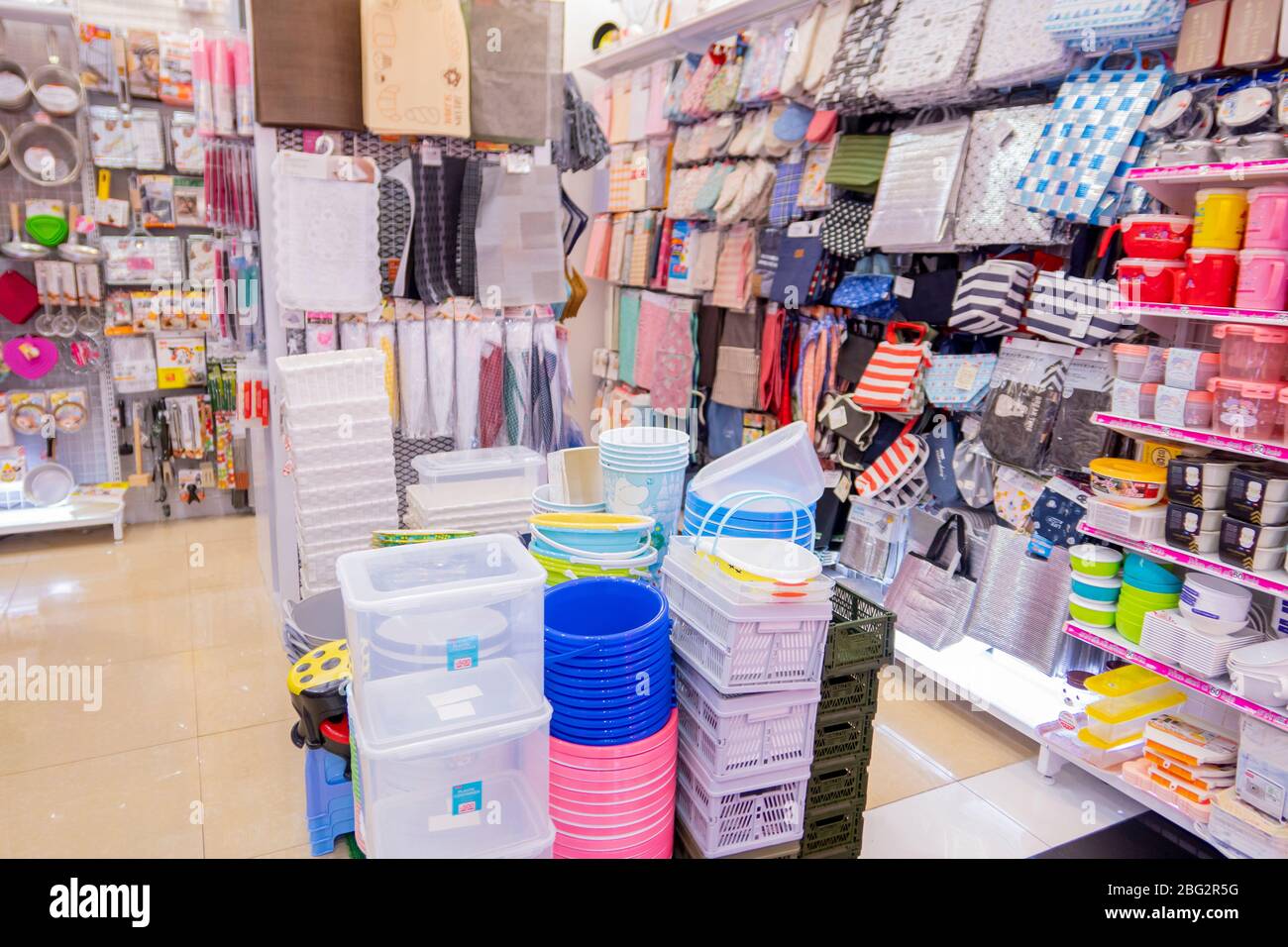Plastic ware were piled for sell in Daiso shop at village market. Hua